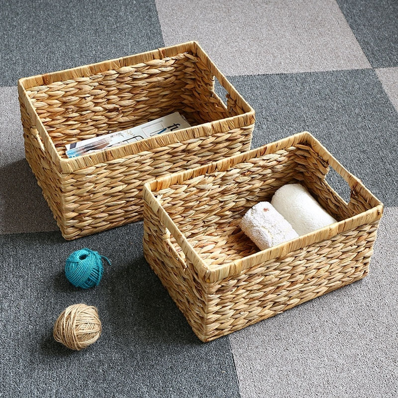 Woven rattan storage box with two sturdy handles – shown in a room setting (2)