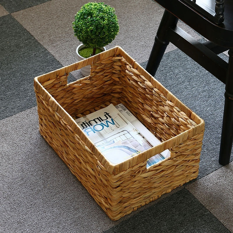 Woven rattan storage box with two sturdy handles – shown in a room setting (3)