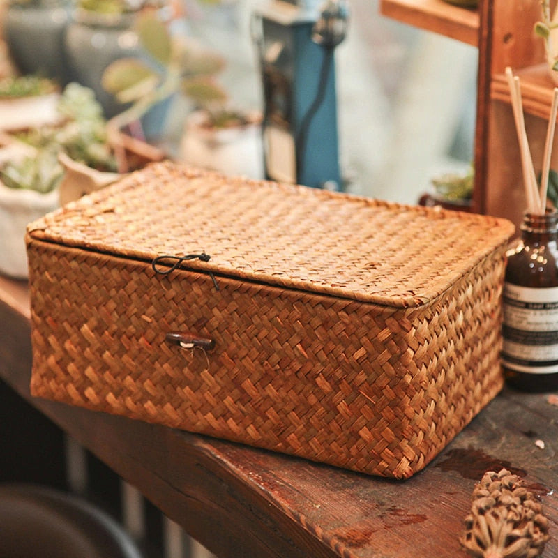 Hand-braided rattan storage basket with a lid, hook and side handles