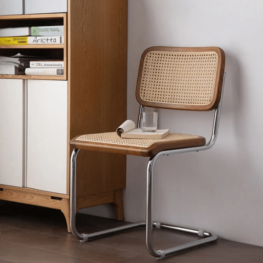Ergonomic round rattan chair with a high hand-braided back – shown in a room setting