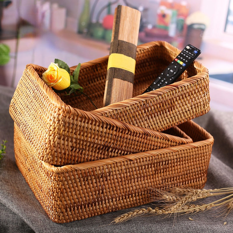Hand-braided rattan toy chest with a lid – shown in a room setting
