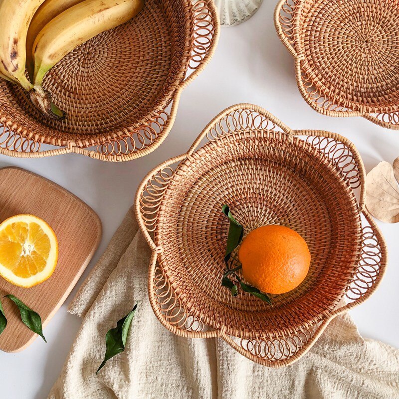 Handwoven round rattan table basket – shown in a room setting