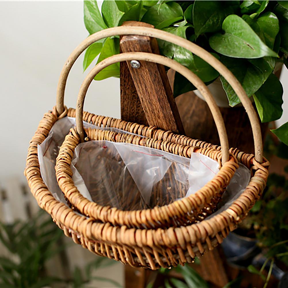 Handwoven natural rattan hanging plant basket – shown outdoors (3)