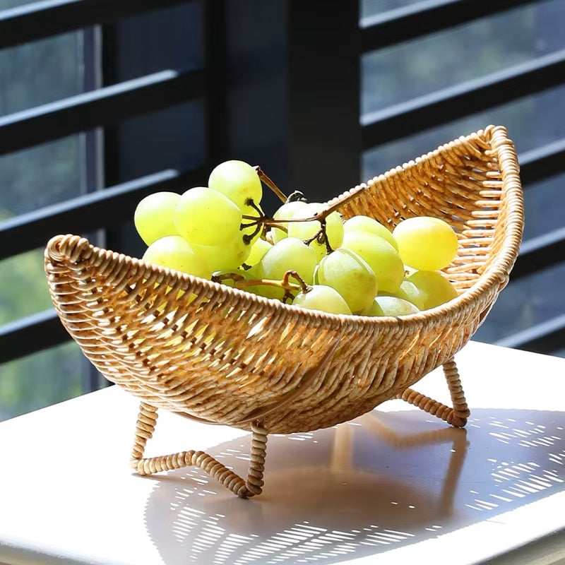 Handwoven natural rattan banana-shaped basket – shown in a room setting (2)