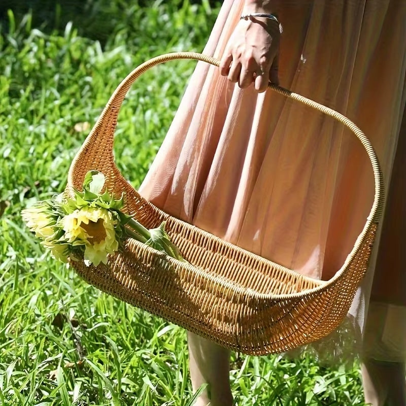 Rustic open-weave rattan basket with a sturdy handle – shown in use (2)