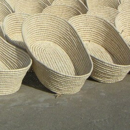 White rattan moses basket with side handles – multiple views
