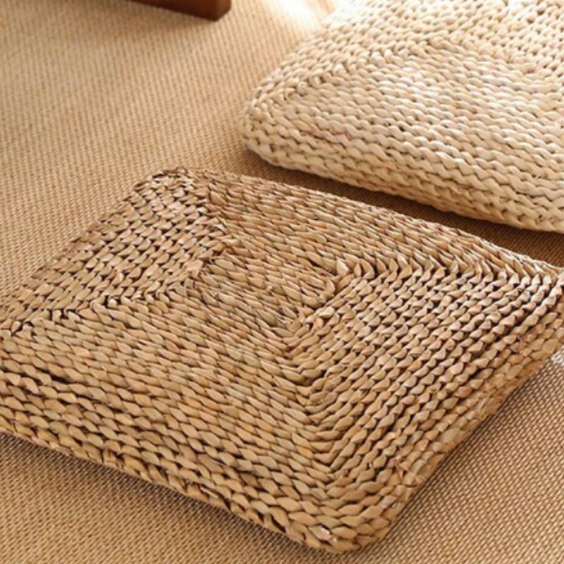 Dark square hand-braided rattan seat pad – shown in a room setting (2)