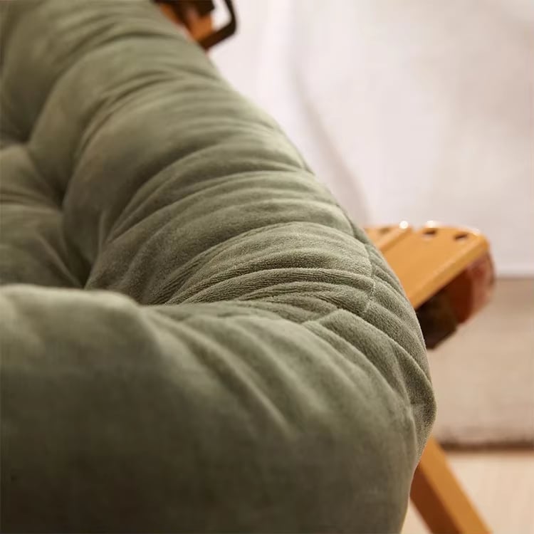 Long deep green chair cushion – close-up detail