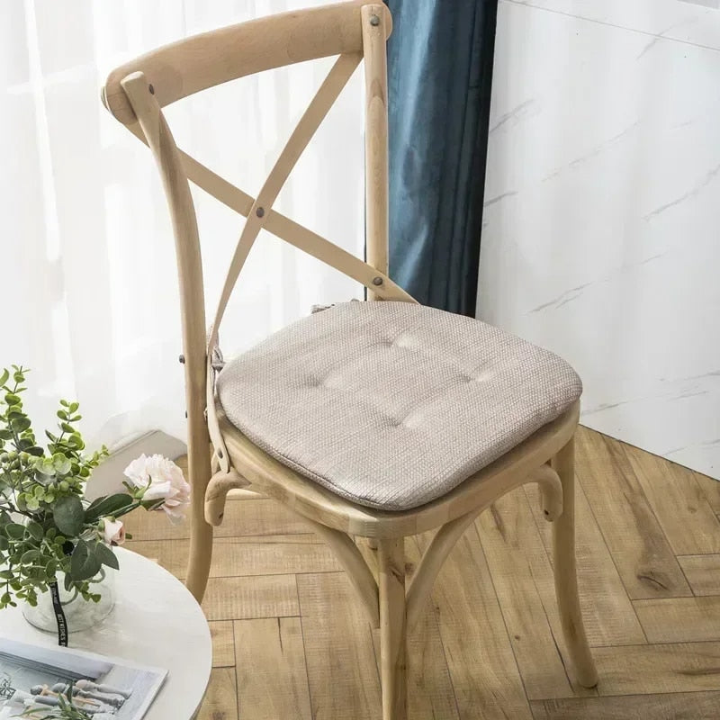 Nordic beige cushion shaped for a rattan armchair – shown in a room setting