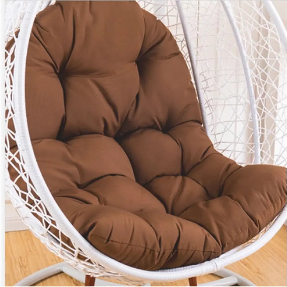 Spacious padded cushion for a rattan loveseat chair – brown variant, shown in a room setting