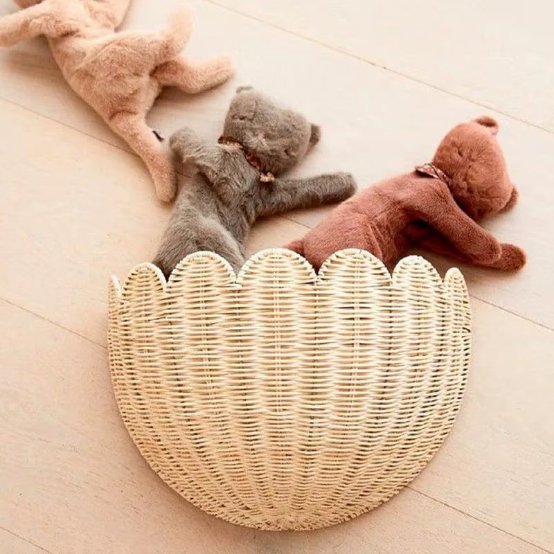 Handwoven round rattan wall basket with concentric circles – shown in a room setting