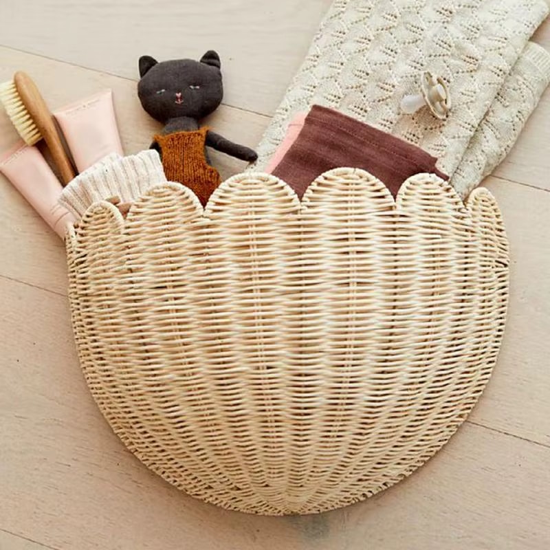 Handwoven round rattan wall basket with concentric circles – shown in a room setting (2)