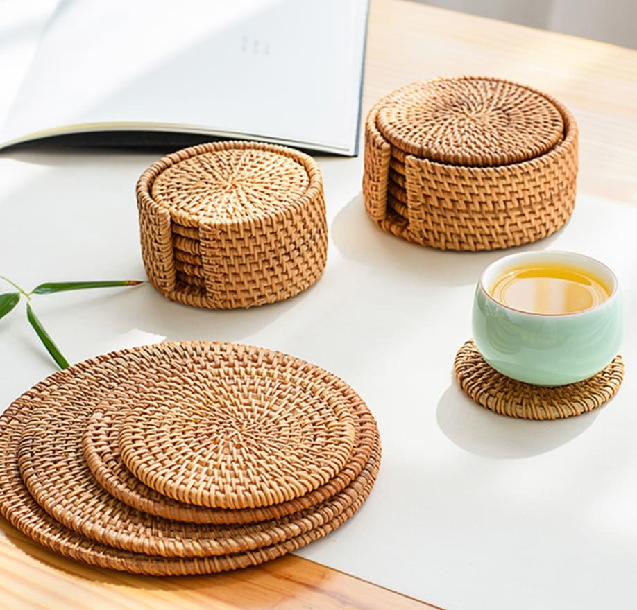 Set of six round rattan coasters with a non-slip base – shown in a room setting (2)