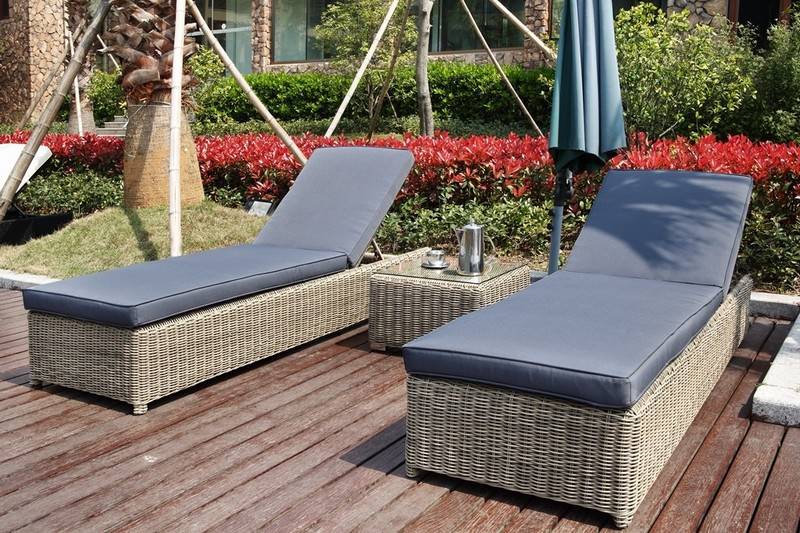 Dune round resin wicker chaise lounge set of two with wheels – shown outdoors (5)