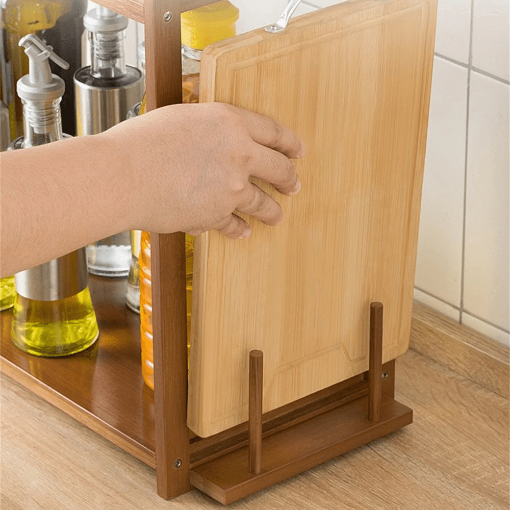 Bamboo microwave shelf with a raised top and compartments below – shown in use