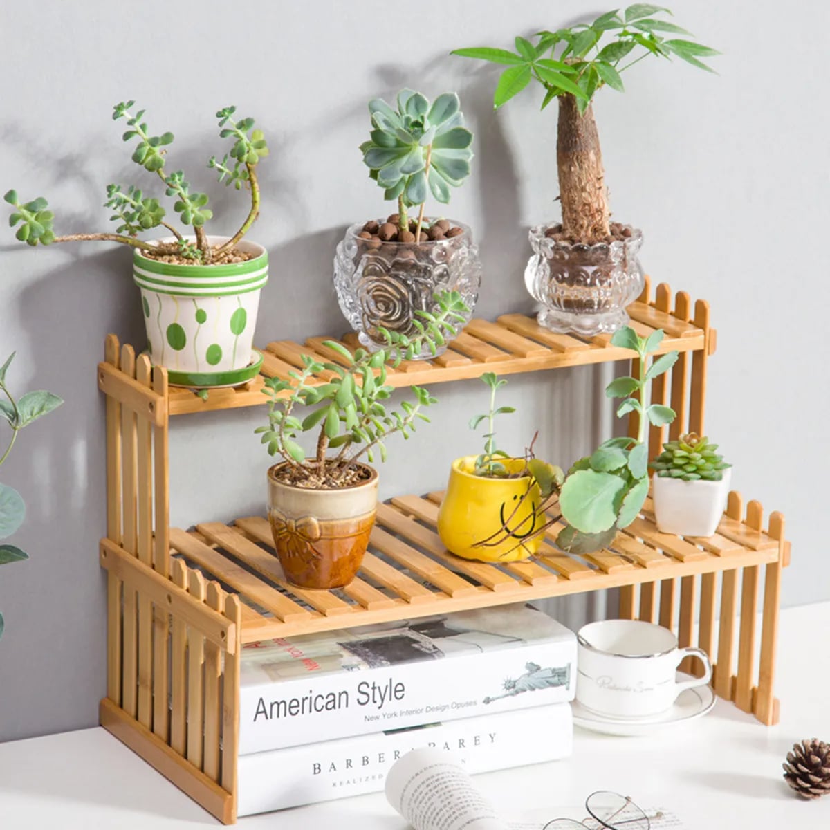 Natural slatted two-tier bamboo shelf with straight uprights – shown in a room setting