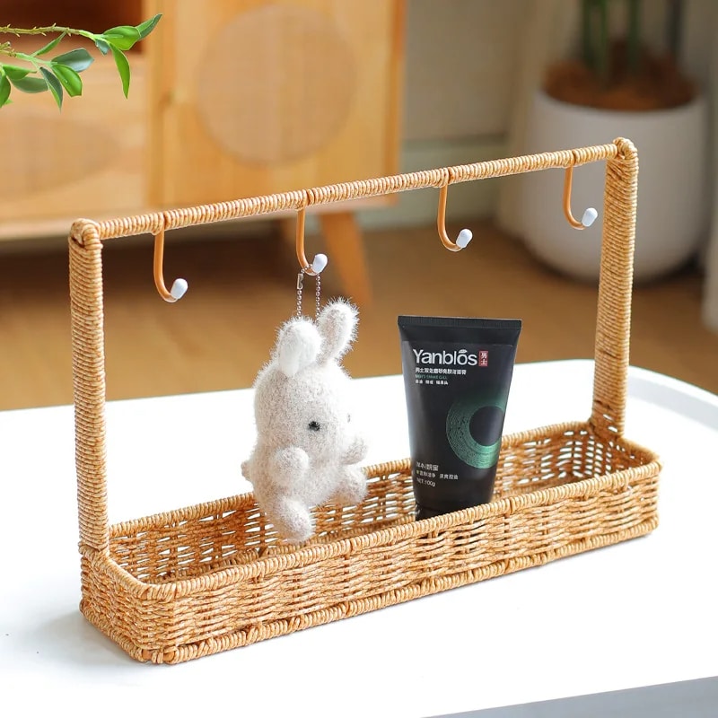 Compact rattan-look wall shelf with hooks – shown in a room setting