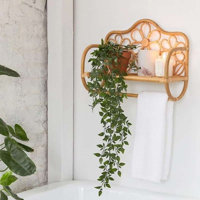 Bench-shaped rattan wall shelf with hand-braided legs – shown in a room setting (2)