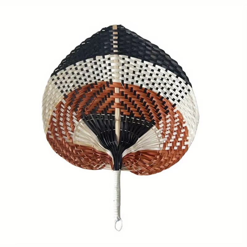 Braided raw rattan fan mounted on a slim stick