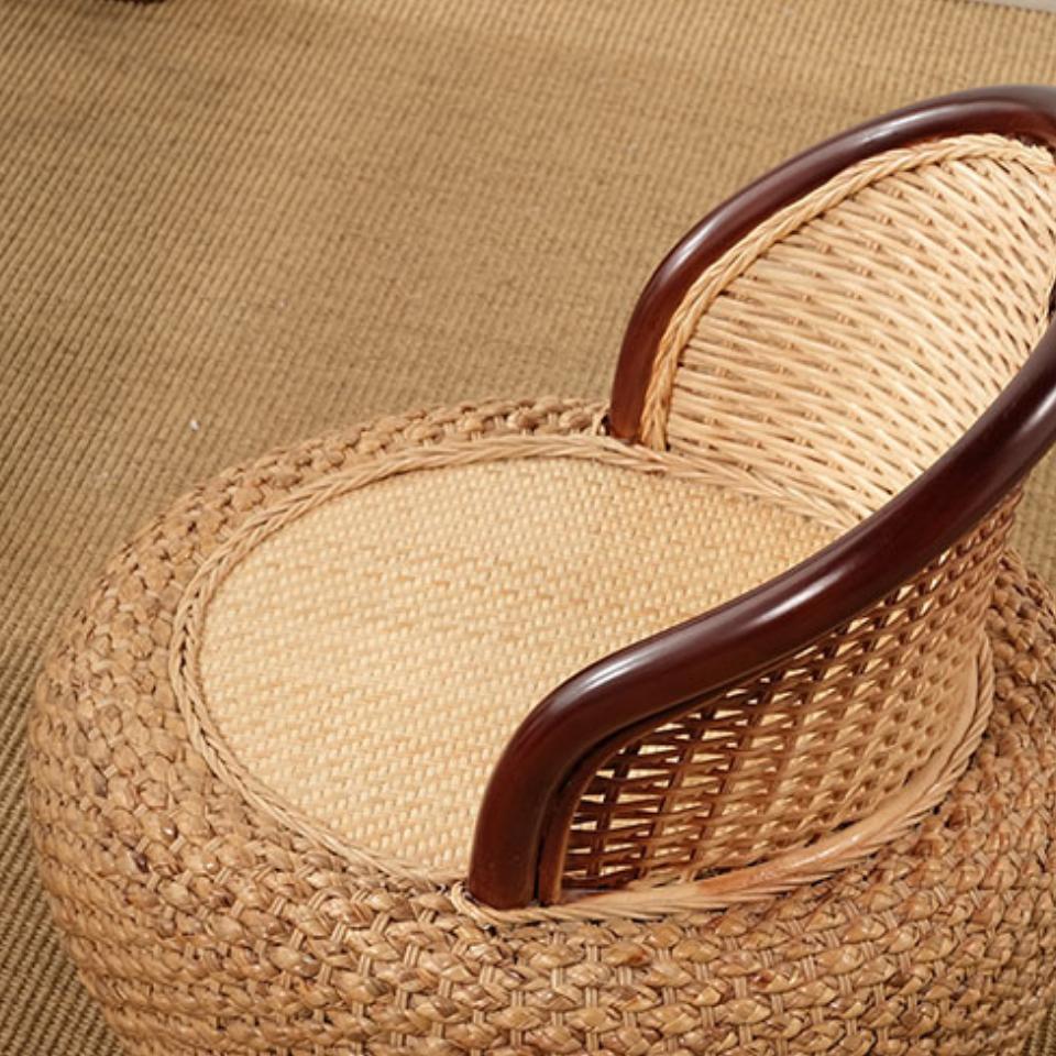 Two-tone low rattan armchair with beige weave and brown frame – close-up detail