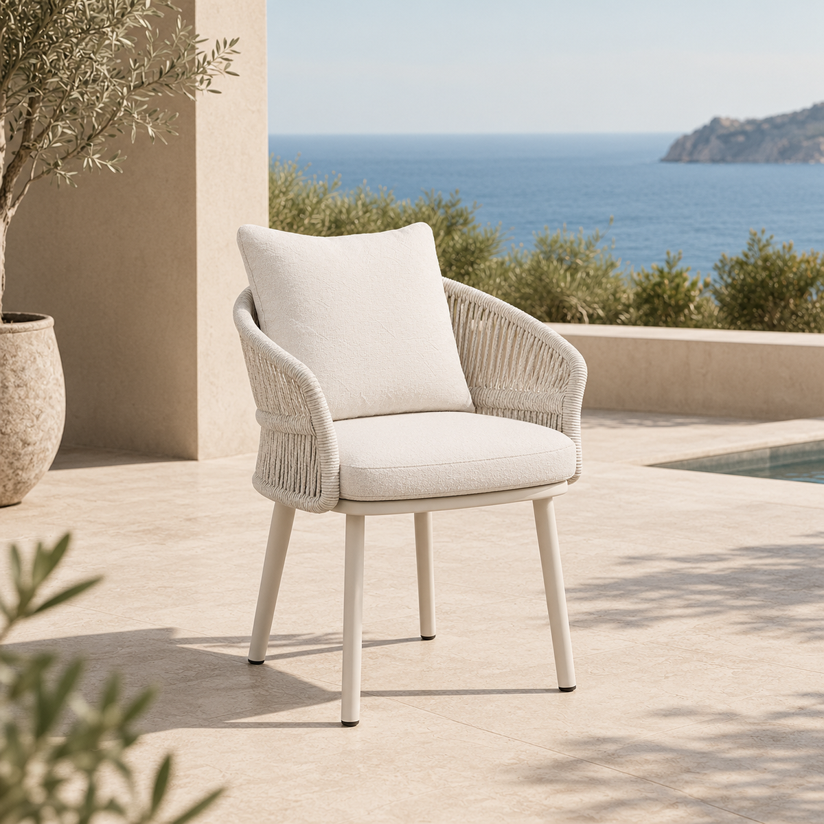 Laska beige aluminum and teak dining armchair – shown outdoors