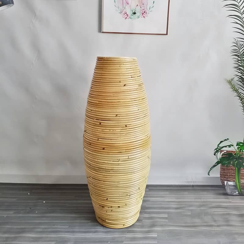 Large natural rattan vase with regular ribs – shown in a room setting (2)