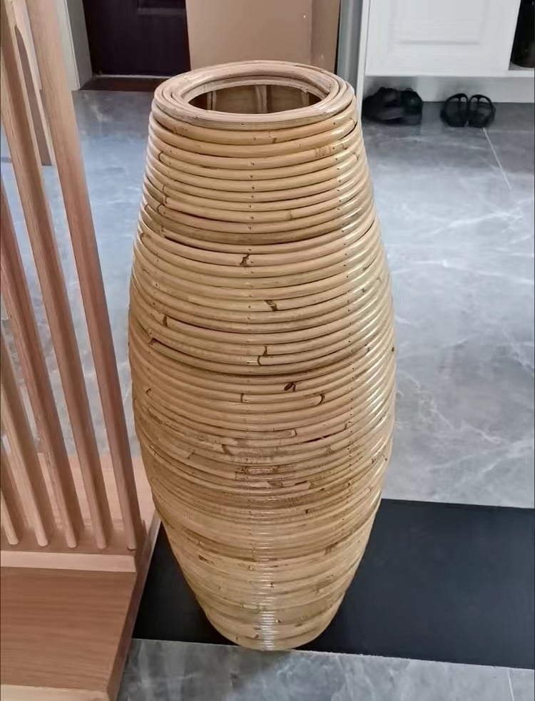 Large natural rattan vase with regular ribs – shown in a room setting (3)