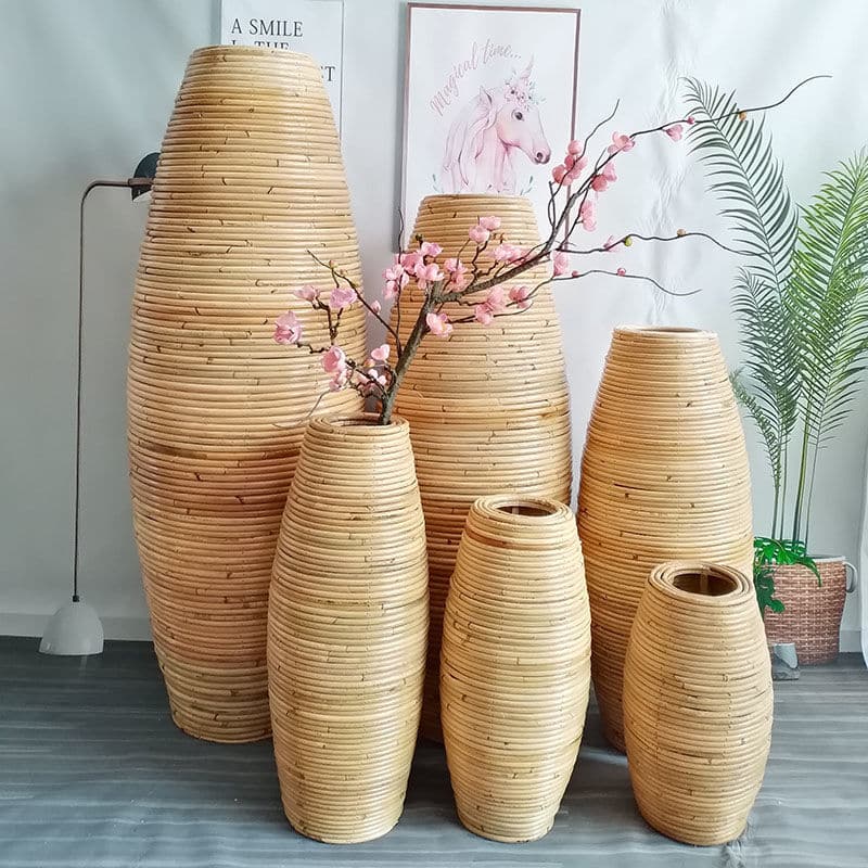 Large natural rattan vase with regular ribs – shown in a room setting