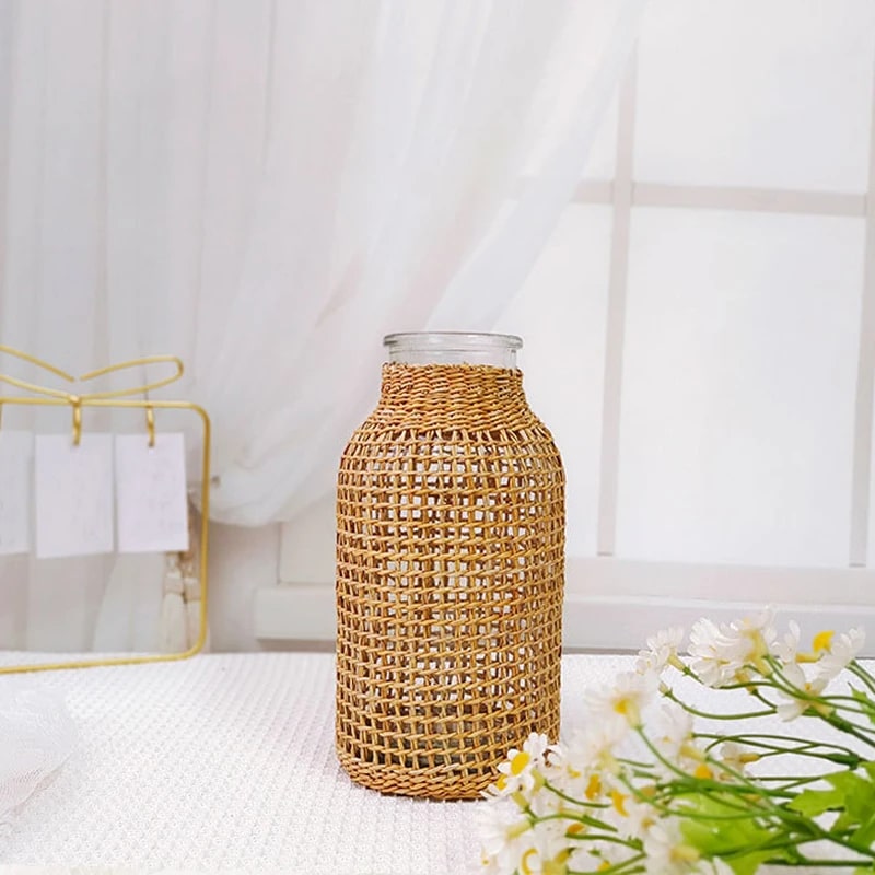 Handwoven wicker vase with a clear glass insert – shown in a room setting (2)