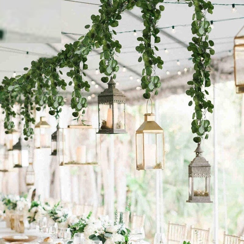 Artificial eucalyptus garland with small white flowers – shown in a room setting
