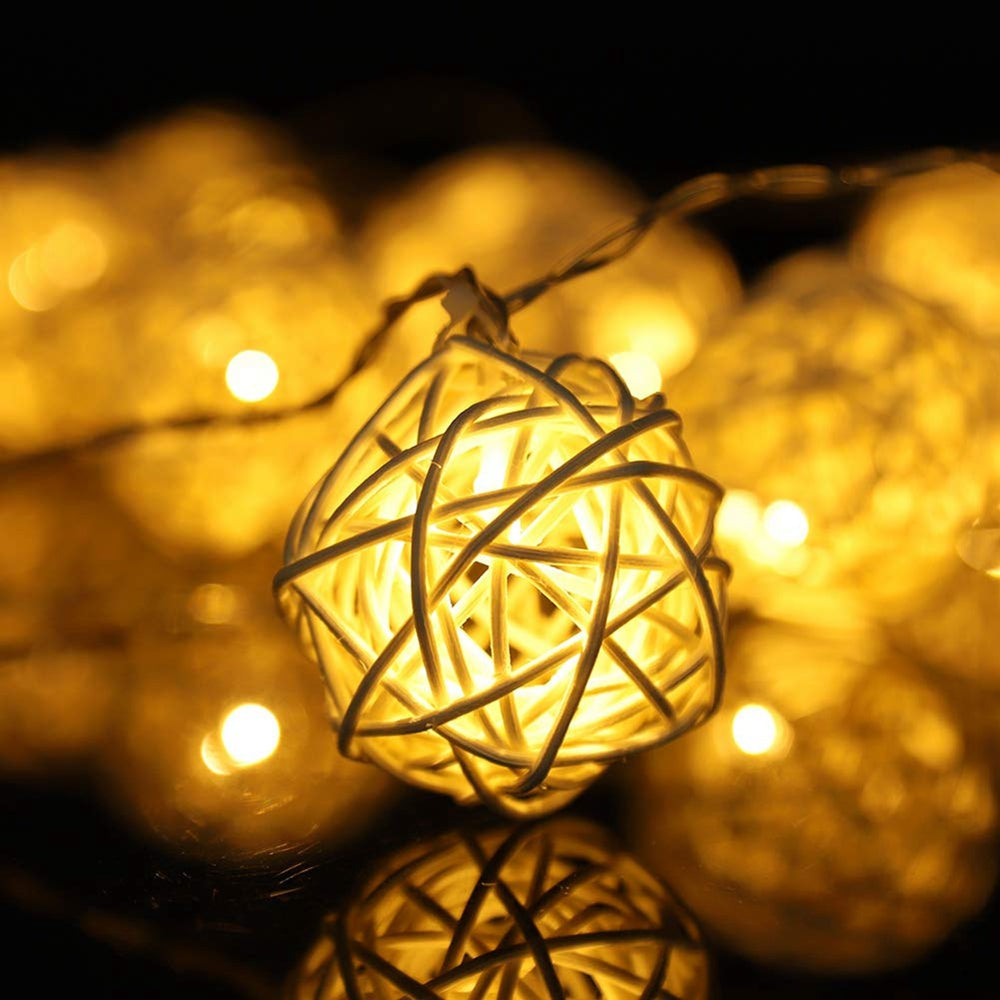 Rattan Christmas string lights with miniature woven shades – shown lit