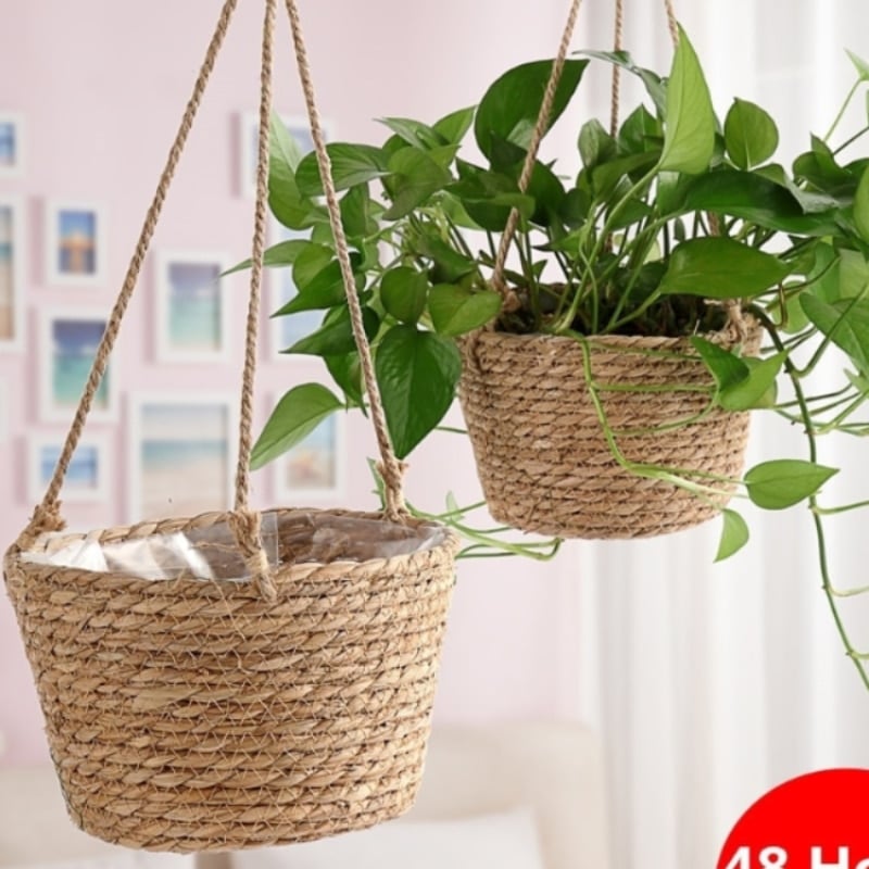 Hand-braided rattan garden hanging planter – shown in a room setting
