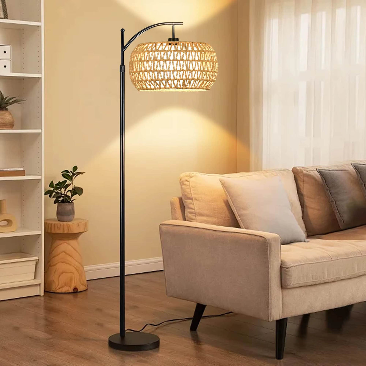 Bohemian rattan floor lamp with a hand-braided shade – shown lit in a room setting
