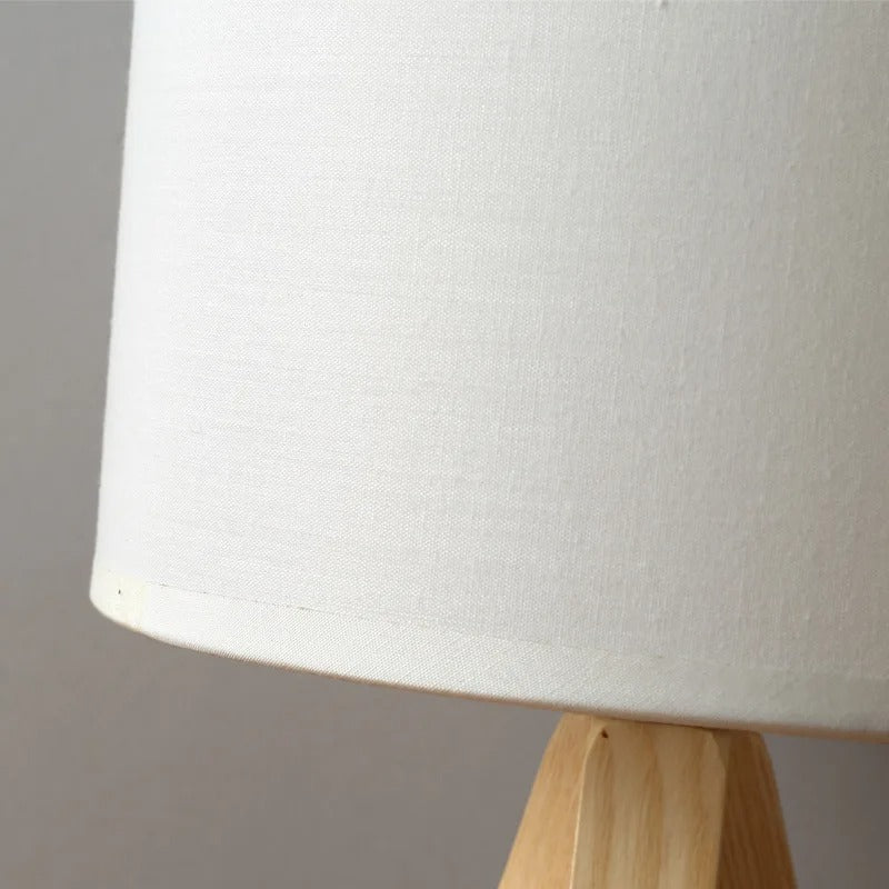 Contemporary natural wood bedside lamp with a handwoven shade – close-up detail