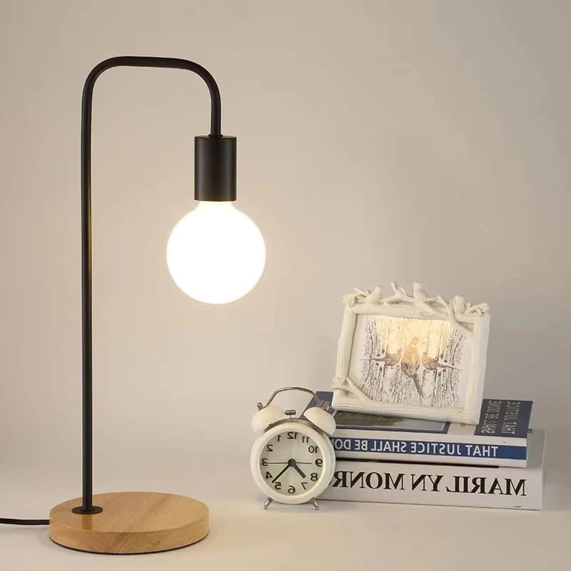 Vintage hand-turned wood and wrought iron LED bedside lamp – shown in a room setting