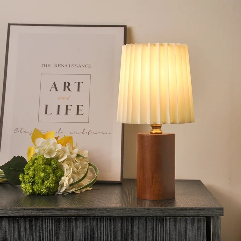 Modern wood bedside lamp with a clean-lined shade – shown in a room setting