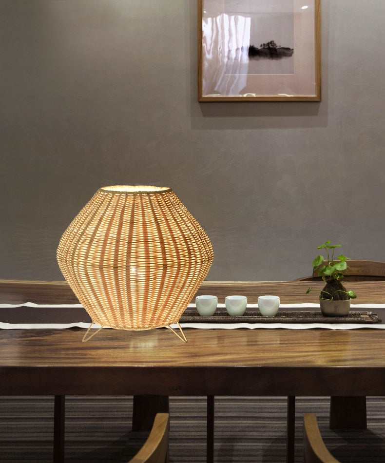 Handwoven tapered natural bamboo table lamp – shown in a room setting (3)
