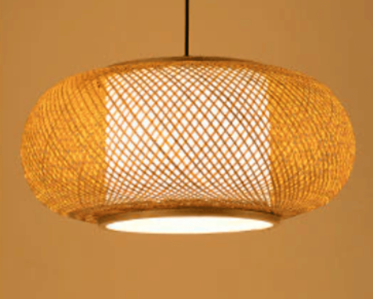 Handwoven natural rattan orb pendant light – shown lit
