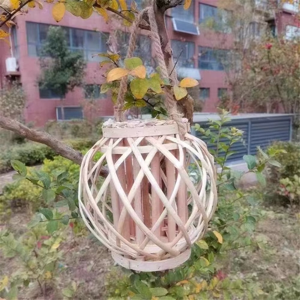 Modern rattan slat lantern with a braided handle – shown outdoors