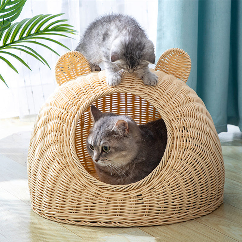 Rattan-look plastic cat bed – shown in a room setting