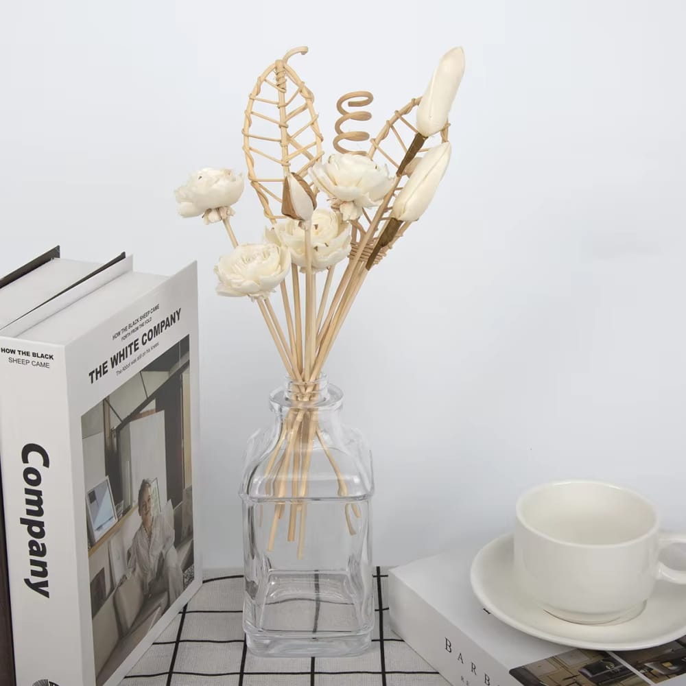 Set of twelve hand-braided rattan flowers – shown in a room setting