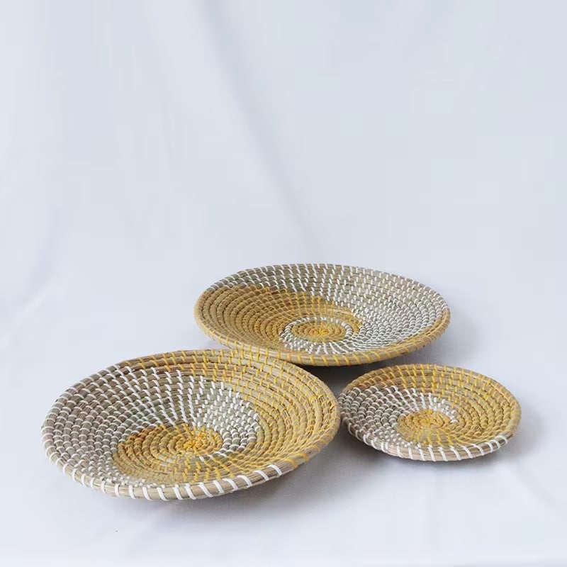 Set of three decorative rattan wall plates in matched sizes