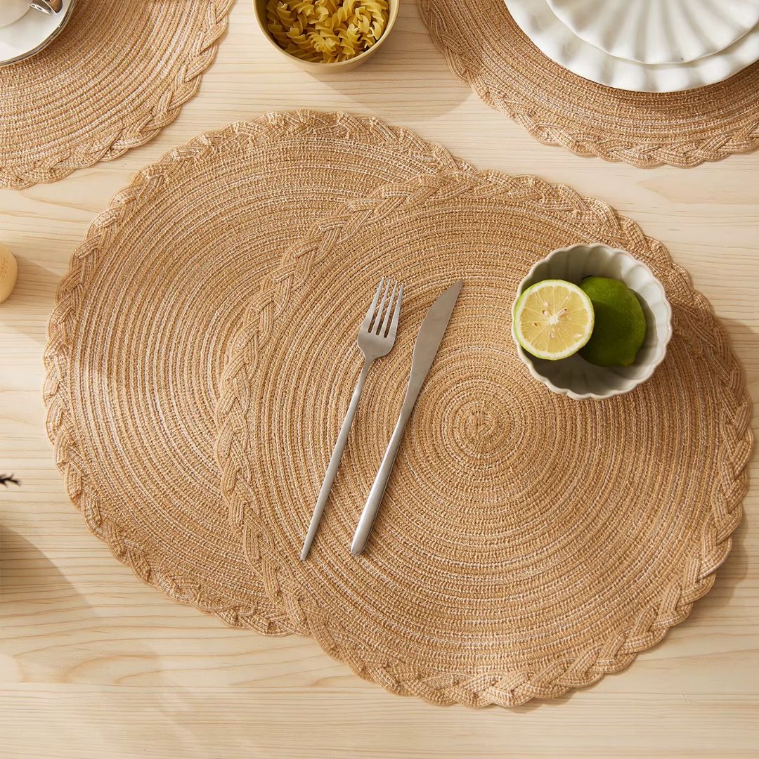 Set of four round spiral-woven placemats – shown in a room setting (2)