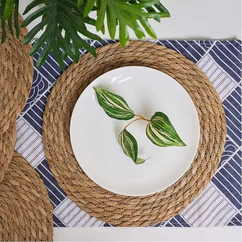 Set of six round braided straw placemats – shown in a room setting (2)