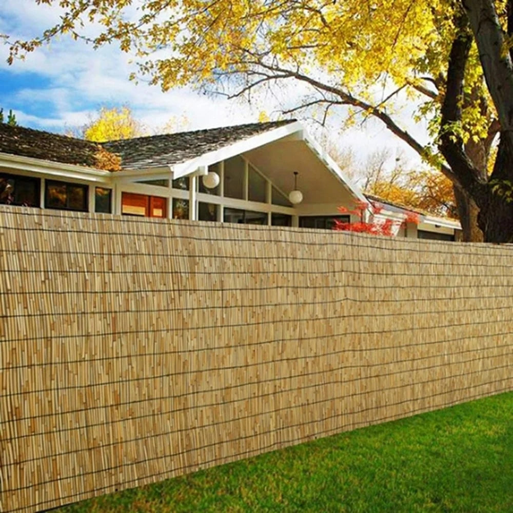 Woven golden reed fence screen with a bamboo look – shown outdoors (3)