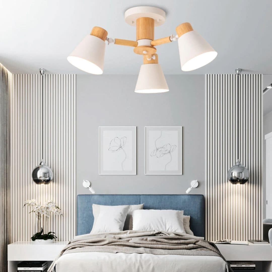 Modern three-arm LED chandelier with natural wood arms – shown in a room setting (2)