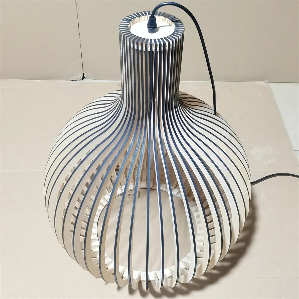 Modern light wood slat LED chandelier with a fine metal frame – shown lit