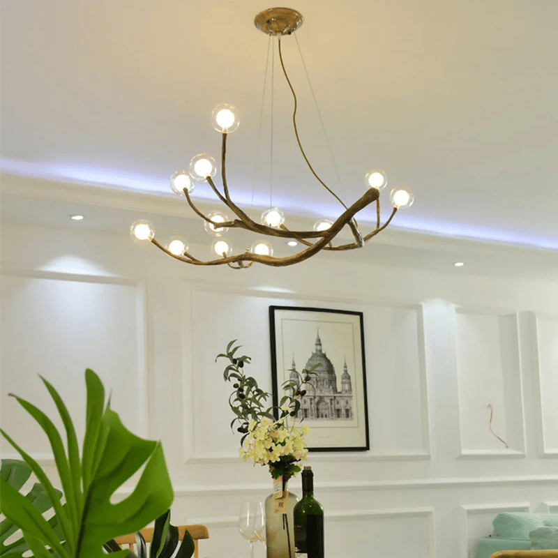 Faux wood branch chandelier with irregular ramifications – shown in a room setting