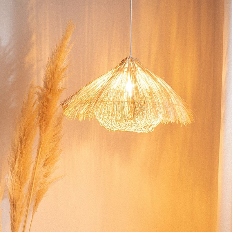 Round yellow bamboo and wood chandelier with an open circular structure – shown lit in a room setting