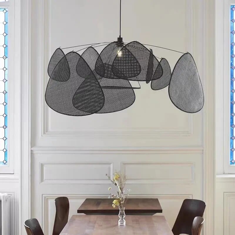 Matte black handwoven rattan pendant light – shown in a room setting
